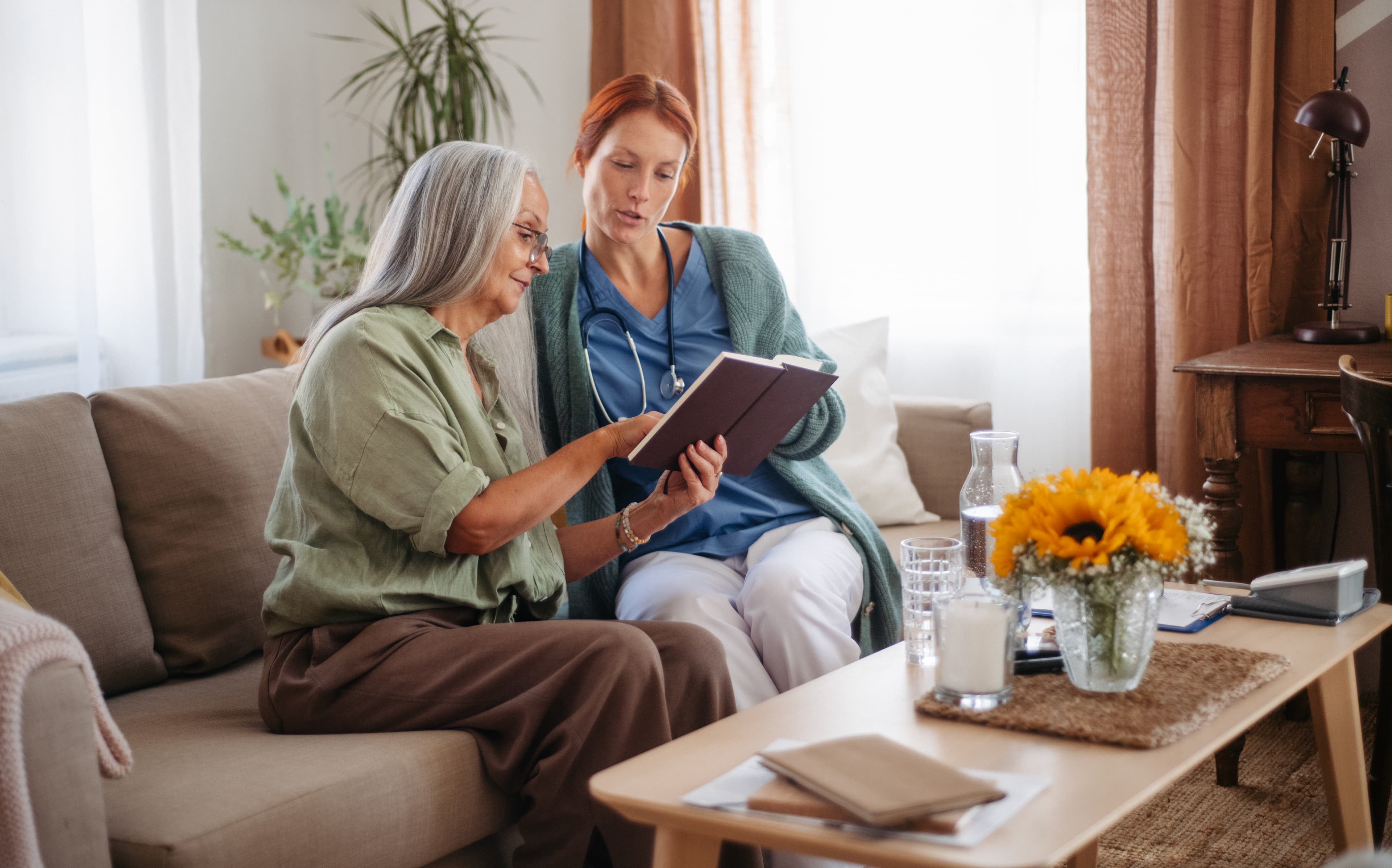 A patient at home going through a care plan together with a family member